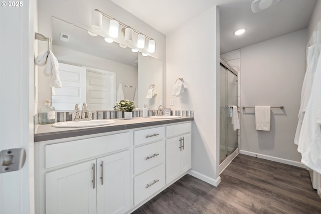 1540 19th Ave, Forest Grove, OR 97116 - bathroom with double vanity, a shower stall, wood finished floors, and recessed lighting