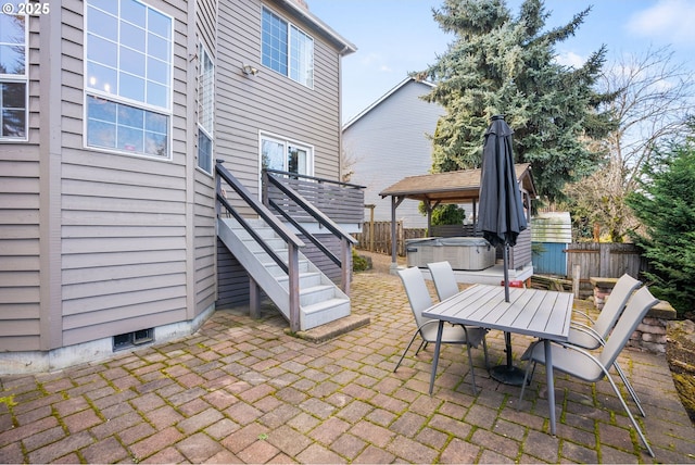 view of patio / terrace with a hot tub