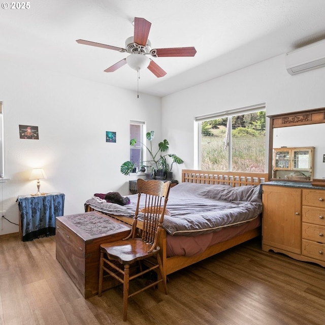 1104 Upper Cow Creek Rd, Azalea, OR 97410 - bedroom featuring an AC wall unit and light wood-style flooring