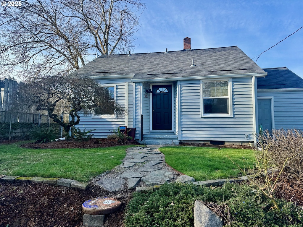 bungalow with a front yard