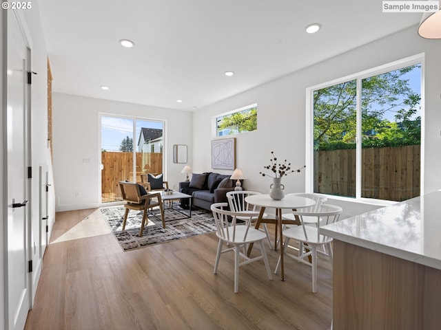 1212 SE Center St Unit 6, Portland, OR 97202 - dining room featuring light wood-type flooring, healthy amount of natural light, and recessed lighting