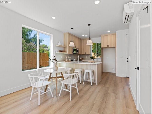 1212 SE Center St Unit 6, Portland, OR 97202 - dining area featuring recessed lighting, light wood finished floors, and an AC wall unit