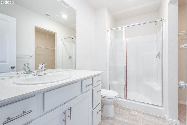 2990 T St, Springfield, OR 97477 - full bath featuring vanity, a stall shower, wood finished floors, and a spacious closet