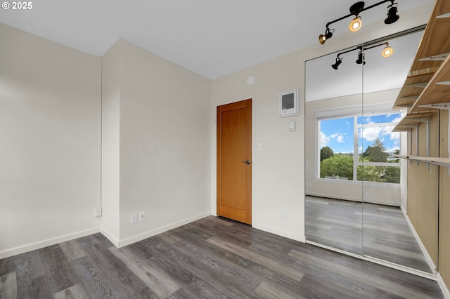 1313 Lincoln St Unit 708, Eugene, OR 97401 - spare room featuring dark wood-style floors and track lighting