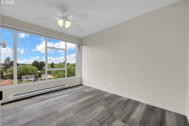 1313 Lincoln St Unit 708, Eugene, OR 97401 - spare room with a baseboard heating unit, wood finished floors, healthy amount of natural light, and a ceiling fan
