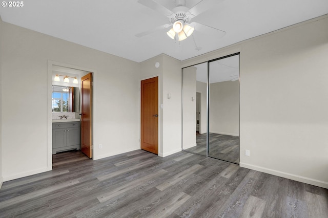 1313 Lincoln St Unit 708, Eugene, OR 97401 - unfurnished bedroom with wood finished floors, a closet, ceiling fan, and ensuite bathroom