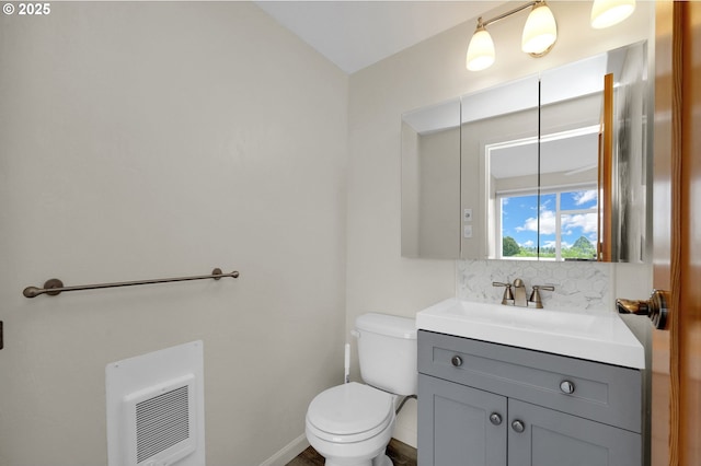 1313 Lincoln St Unit 708, Eugene, OR 97401 - half bathroom with vanity, backsplash, heating unit, and vaulted ceiling