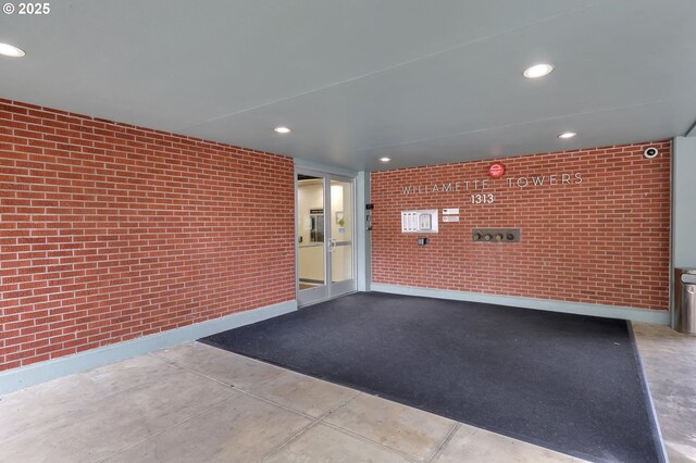 1313 Lincoln St Unit 708, Eugene, OR 97401 - exterior space with brick wall and recessed lighting