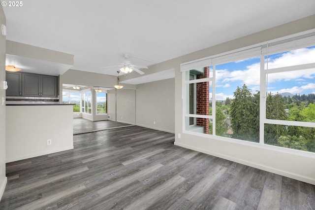 1313 Lincoln St Unit 708, Eugene, OR 97401 - unfurnished living room featuring dark wood finished floors and a ceiling fan