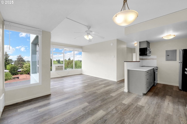1313 Lincoln St Unit 708, Eugene, OR 97401 - kitchen with appliances with stainless steel finishes, gray cabinets, ceiling fan, and wood finished floors