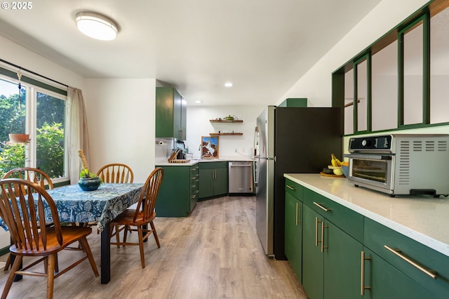 14511 NE Brazee Ct, Portland, OR 97230 - kitchen featuring green cabinetry, stainless steel appliances, light wood finished floors, light countertops, and recessed lighting
