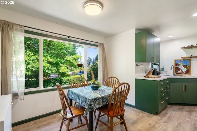 14511 NE Brazee Ct, Portland, OR 97230 - dining room featuring light wood-style flooring and baseboards