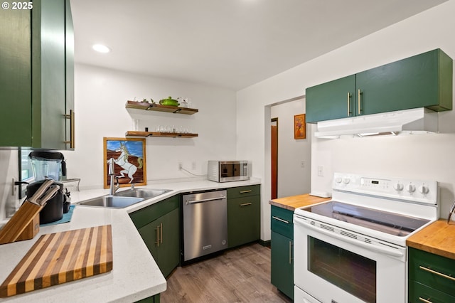 14511 NE Brazee Ct, Portland, OR 97230 - kitchen with appliances with stainless steel finishes, under cabinet range hood, green cabinets, and recessed lighting