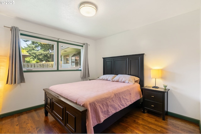 14511 NE Brazee Ct, Portland, OR 97230 - bedroom featuring dark wood-style flooring and baseboards