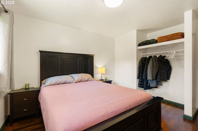 14511 NE Brazee Ct, Portland, OR 97230 - bedroom with dark wood finished floors, baseboards, and a closet