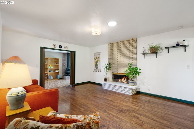 14511 NE Brazee Ct, Portland, OR 97230 - living room with wood finished floors, a brick fireplace, baseboards, and recessed lighting