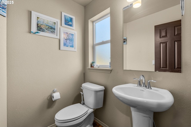 bathroom with sink and toilet