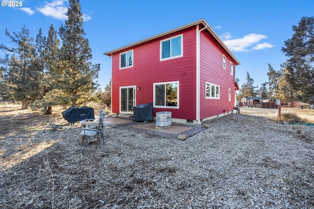 back of property featuring a patio area