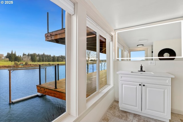 bathroom featuring a water view and vanity