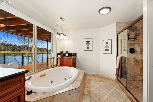 bathroom featuring vanity, plus walk in shower, and a water view