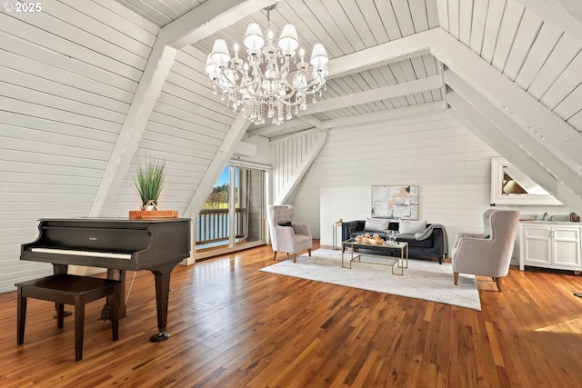 sitting room featuring vaulted ceiling with beams, wooden walls, and light hardwood / wood-style floors