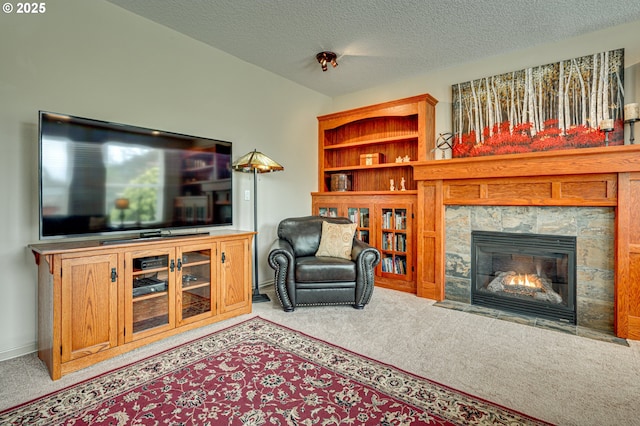 1551 S 14th Cir, Ridgefield, WA 98642 - carpeted living room with a stone fireplace and a textured ceiling