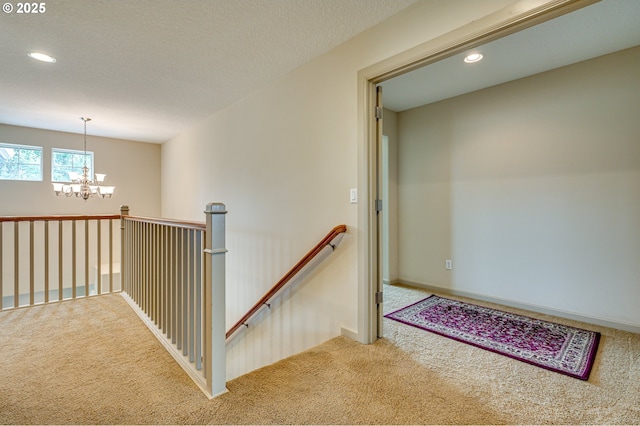 1551 S 14th Cir, Ridgefield, WA 98642 - corridor with carpet floors, an upstairs landing, a chandelier, and recessed lighting