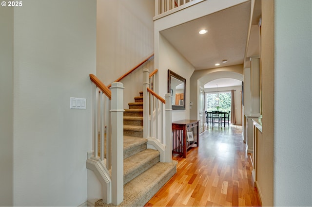 1551 S 14th Cir, Ridgefield, WA 98642 - foyer entrance featuring arched walkways, light wood finished floors, recessed lighting, and stairway