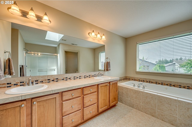 1551 S 14th Cir, Ridgefield, WA 98642 - full bathroom featuring a shower stall, tile patterned floors, double vanity, a garden tub, and tasteful backsplash