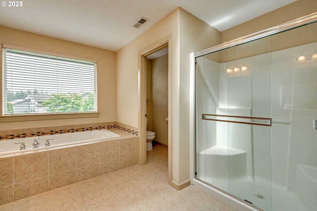 1551 S 14th Cir, Ridgefield, WA 98642 - bathroom featuring a stall shower, a garden tub, and tile patterned flooring
