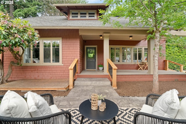 2340 SW Dolph Ct, Portland, OR 97219 - view of front of house featuring roof with shingles and a porch