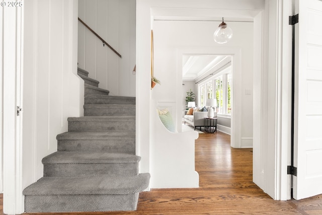 2340 SW Dolph Ct, Portland, OR 97219 - stairway featuring wood finished floors and crown molding