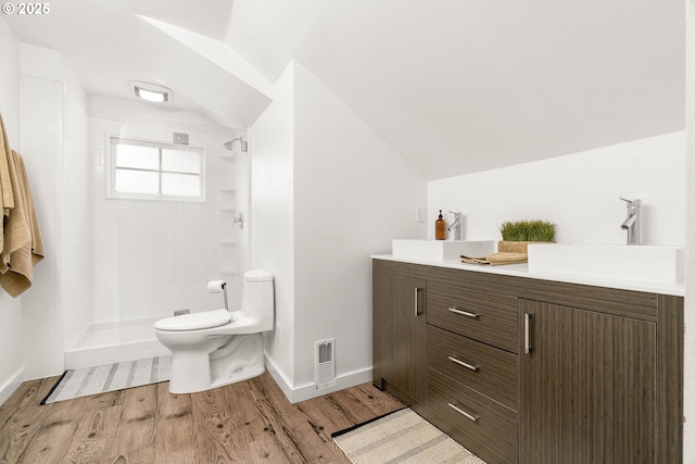 2340 SW Dolph Ct, Portland, OR 97219 - full bath featuring wood finished floors, vaulted ceiling, toilet, a shower stall, and double vanity