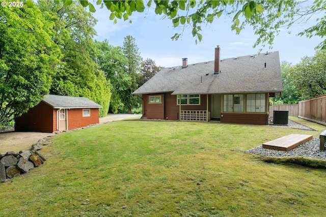 2340 SW Dolph Ct, Portland, OR 97219 - back of house featuring cooling unit, a chimney, and an outbuilding