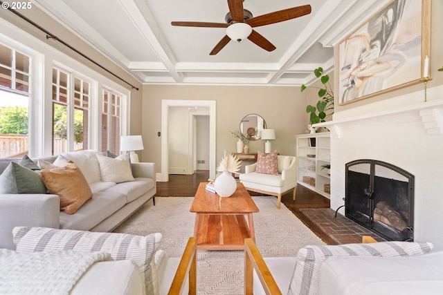 2340 SW Dolph Ct, Portland, OR 97219 - living area with coffered ceiling, a ceiling fan, baseboards, a brick fireplace, and beamed ceiling