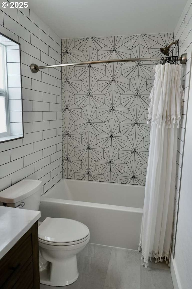 full bath with vanity, shower / bathtub combination with curtain, tile patterned flooring, and toilet