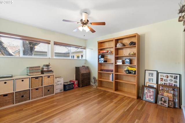 miscellaneous room featuring ceiling fan and light wood-type flooring