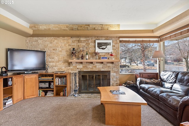 living room with a fireplace and light colored carpet