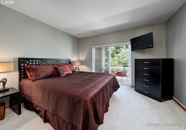 305 S Montgomery St Unit 404, Portland, OR 97201 - bedroom featuring light colored carpet, access to outside, and baseboards