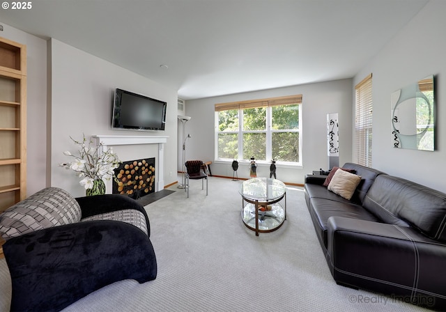 305 S Montgomery St Unit 404, Portland, OR 97201 - living area featuring a fireplace with flush hearth, carpet, and baseboards