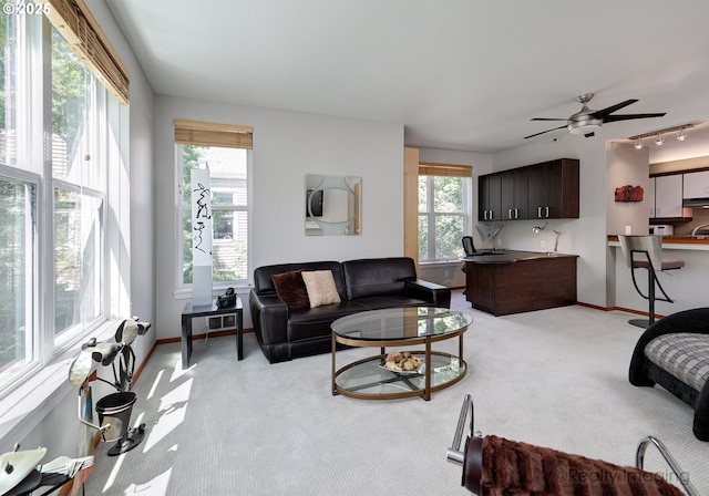 305 S Montgomery St Unit 404, Portland, OR 97201 - living area with light colored carpet, baseboards, and ceiling fan