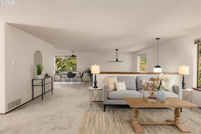 6416 SW 33rd Pl, Portland, OR 97239 - living area featuring light colored carpet, a textured ceiling, and ceiling fan