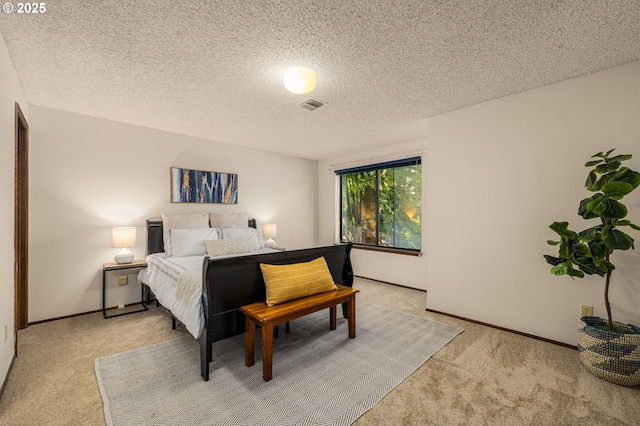6416 SW 33rd Pl, Portland, OR 97239 - bedroom with light carpet, a textured ceiling, and baseboards