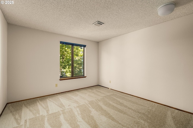 6416 SW 33rd Pl, Portland, OR 97239 - carpeted empty room featuring a textured ceiling and baseboards