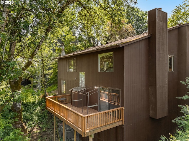 6416 SW 33rd Pl, Portland, OR 97239 - back of property featuring a deck and a chimney