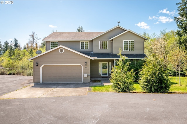view of front of house featuring an attached garage, aphalt driveway, and roof with shingles