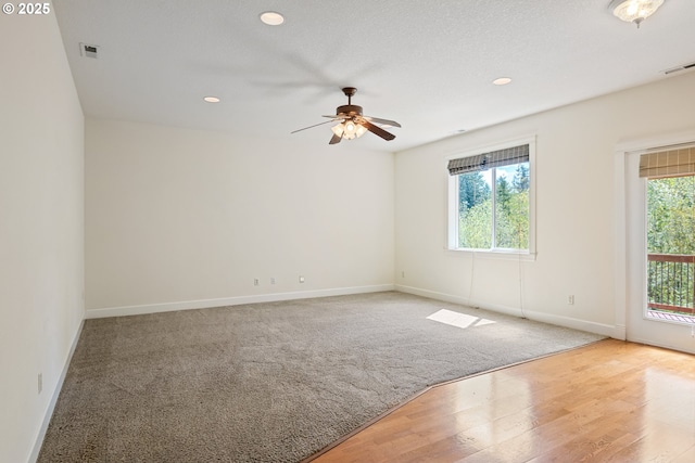 spare room with baseboards, a ceiling fan, visible vents, and recessed lighting