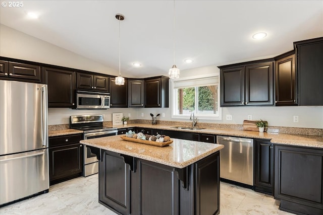 kitchen with appliances with stainless steel finishes, a center island, lofted ceiling, marble finish floor, and a sink