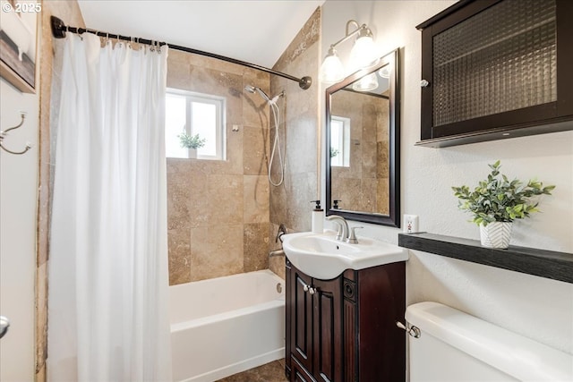 full bathroom with vanity, shower / bath combination with curtain, and toilet