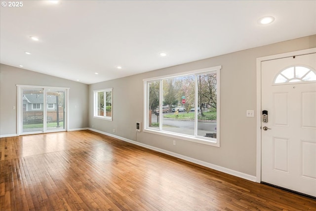 entrance foyer with baseboards, recessed lighting, vaulted ceiling, and hardwood / wood-style flooring